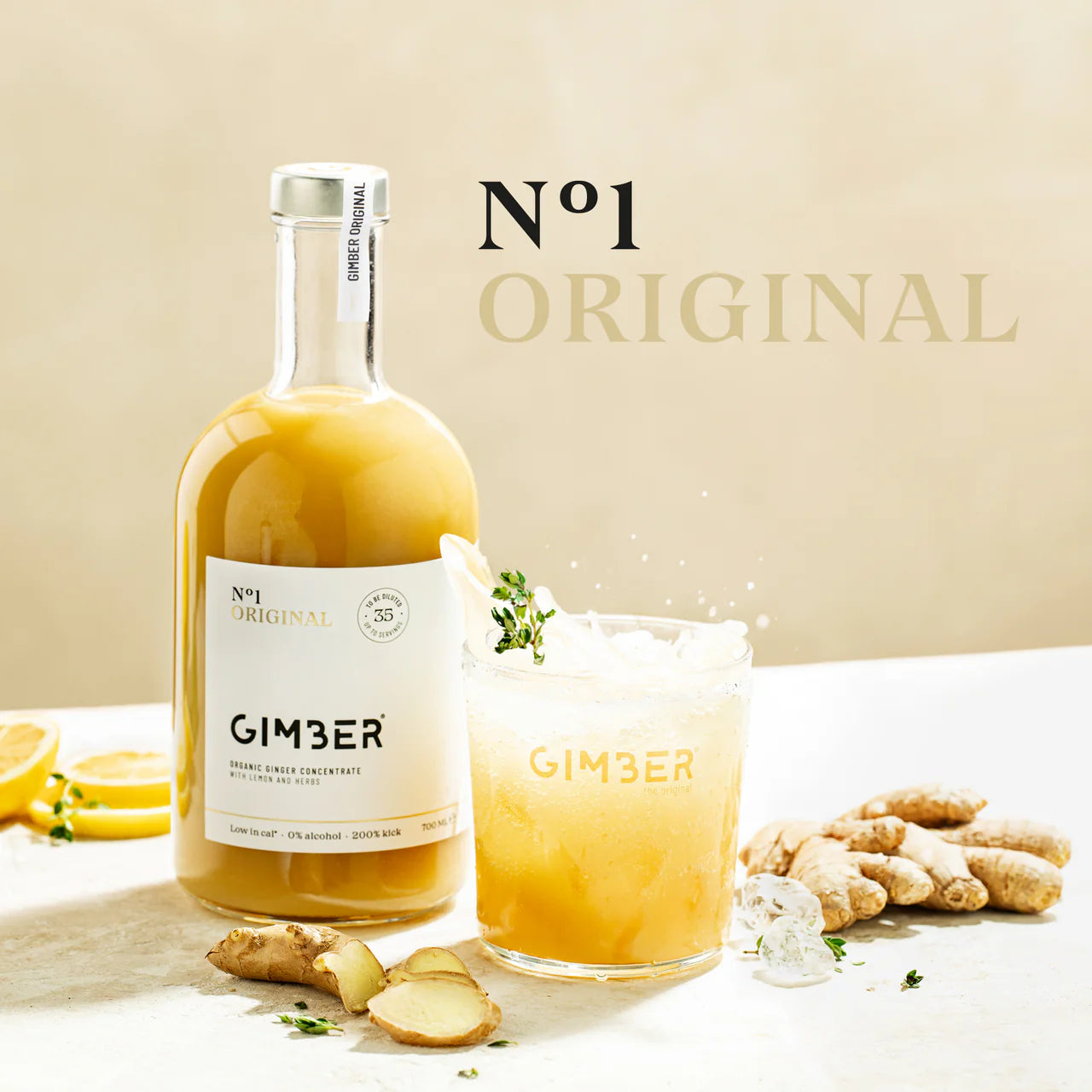Bottle and glass of Gimber ginger juice with ingredients on a light background